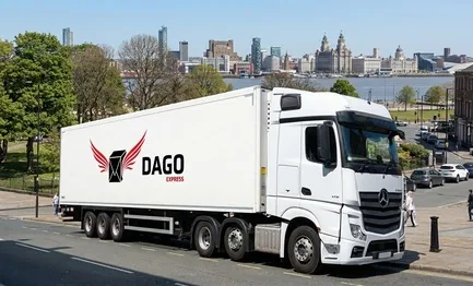 DAGO Express courier service truck in front of Hamilton Square and Birkenhead Priory in Birkenhead